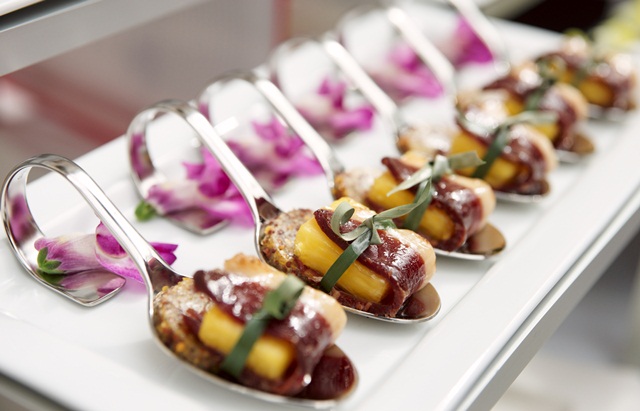 Canapes with cured ham on banquet table